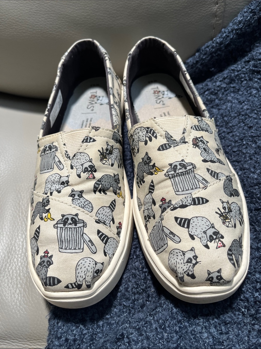 Tom’s Beige Canvas Slip-On with Raccoon Print Womens Size 6.5  Good condition